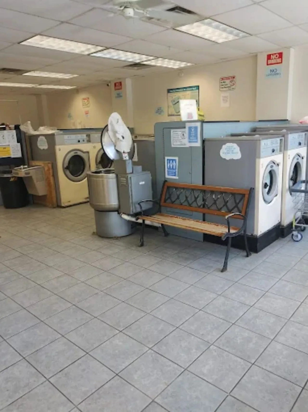 Before renovation: beige machines and a bench