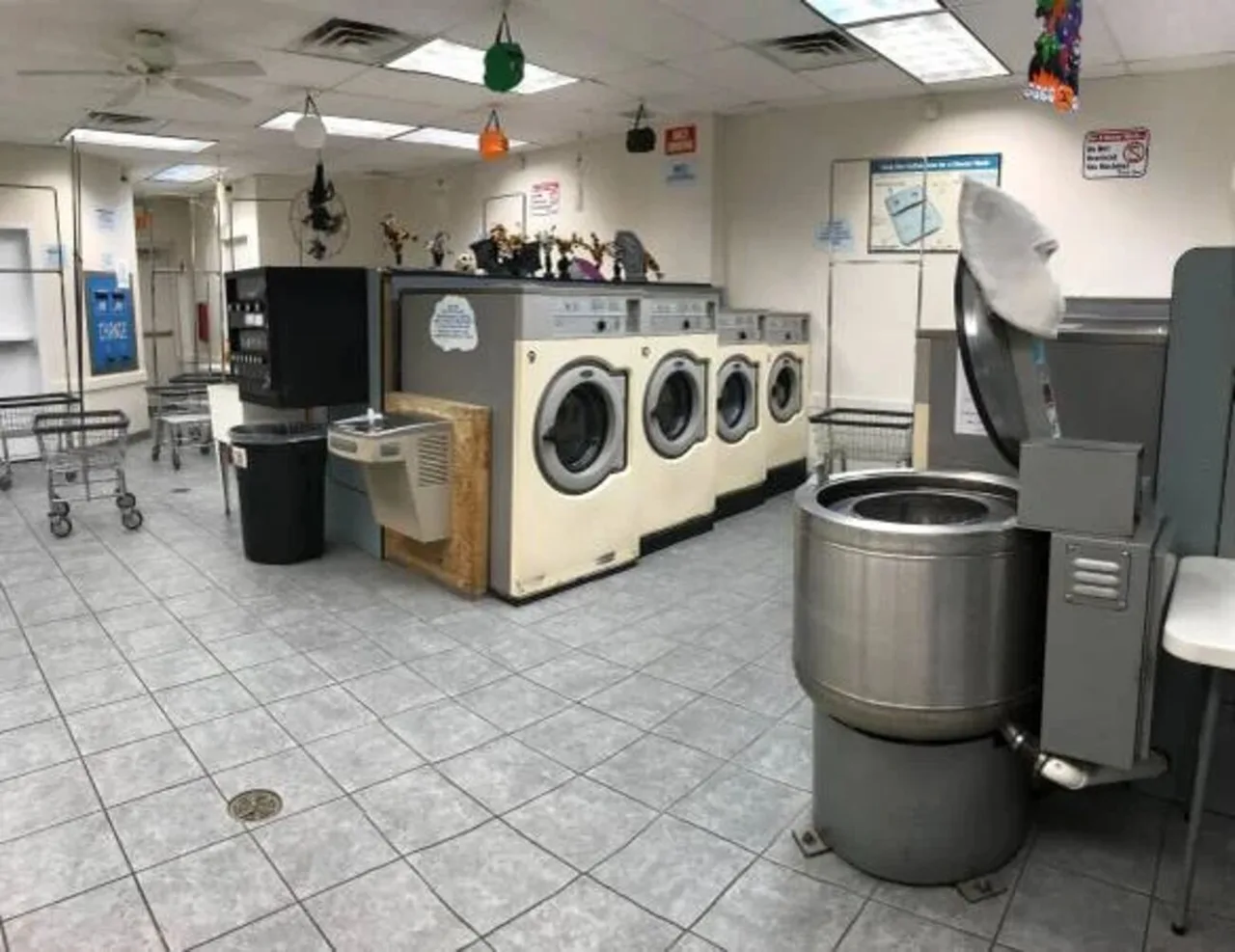 Before renovation: beige washers and carts