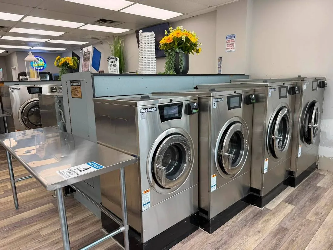 New Huebsch washers under the Poughkeepsie Express Laundry neon sign