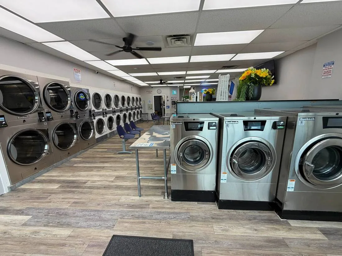 The renovated Poughkeepsie Express Laundry with stainless steel washers and dryers