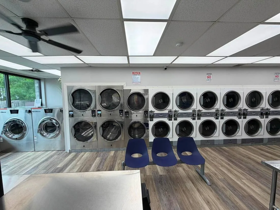 Stacked dryers with seating by the window